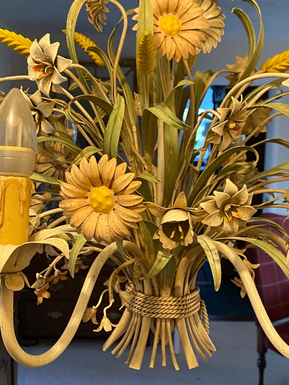 A pair of Italian painted metal toleware chandeliers featuring branching candle arms surrounded by sculpted painted foliage, wheat sheaves, and flowers. View VI