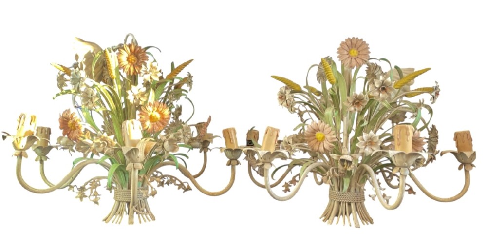 A pair of Italian painted metal toleware chandeliers featuring branching candle arms surrounded by sculpted painted foliage, wheat sheaves, and flowers.