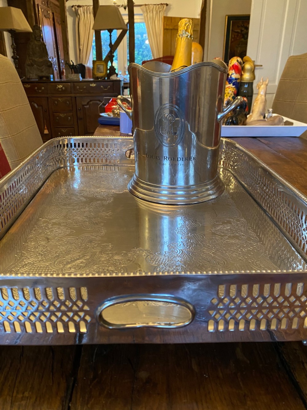 A rectangular silver-plated gallery tray featuring pierced fretwork sides, integrated oval hand-holds, an engraved surface, and ornate scrolled feet. View XV
