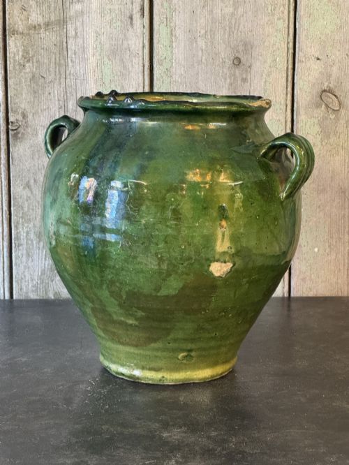 fig 1. A 19th-century French green glazed earthenware confit pot featuring dual side handles and a scalloped rim.