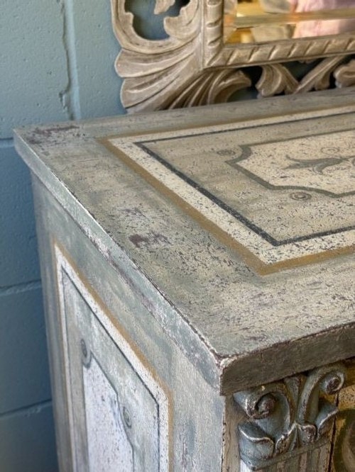 A grey-green hand-painted French Empire chest of drawers featuring guilloche drawer decoration, fluted pilasters, and side cartouche panels. View VIII