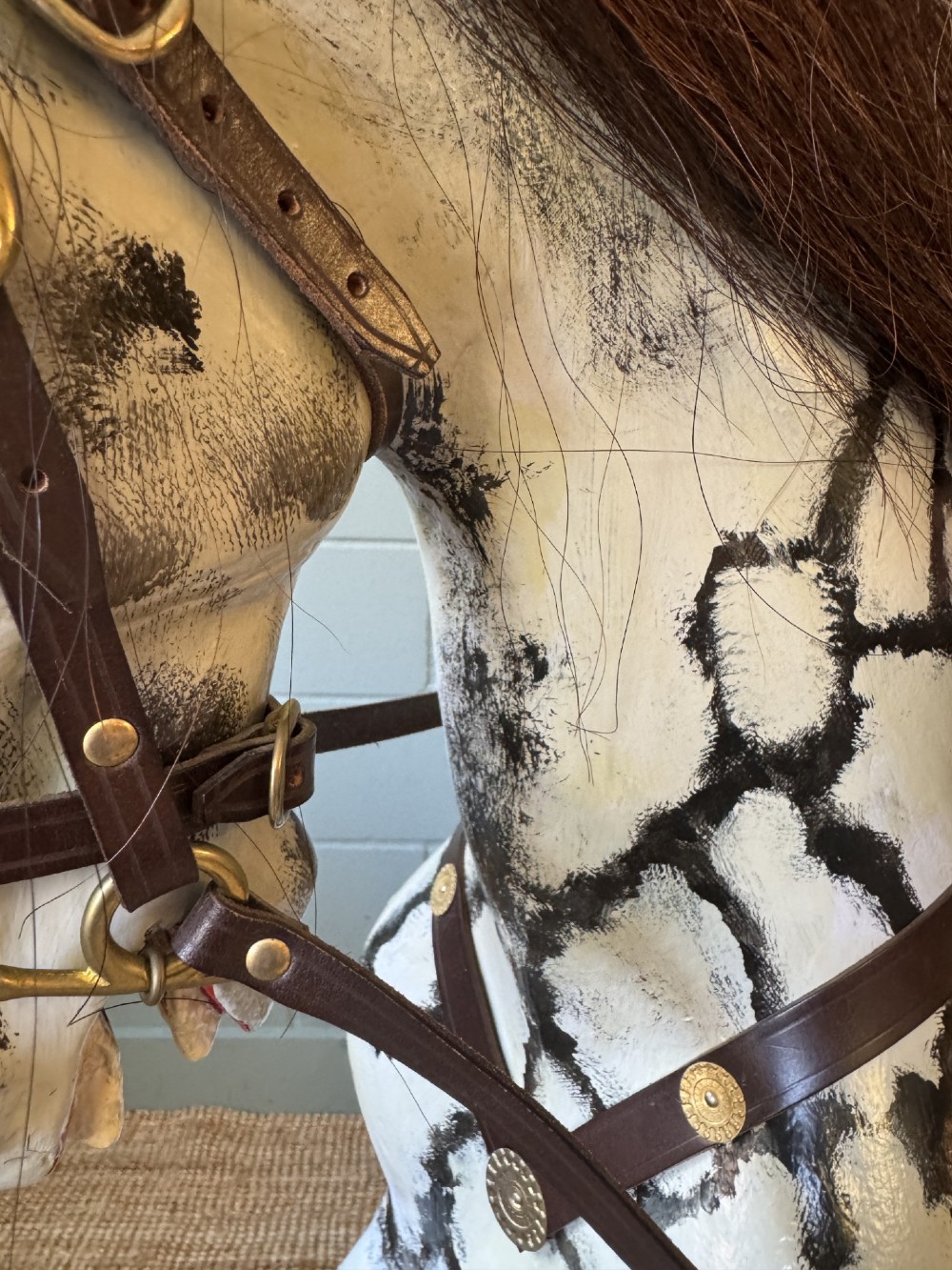 An Edwardian carved wooden dapple grey rocking horse with real horsehair and leather saddle, mounted on a black painted wooden bow rocker. View VI