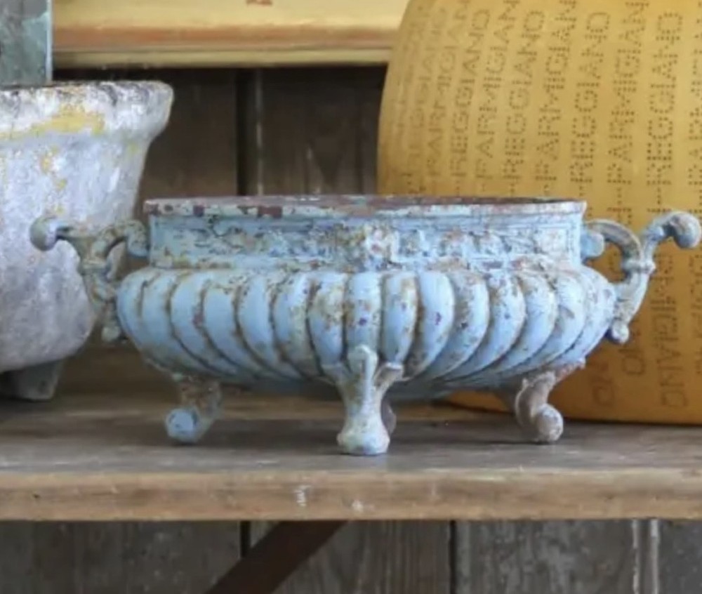 A 19th-century French cast iron jardiniere with fluted details, twin scroll handles, and a distressed pale blue painted surface finish. View III