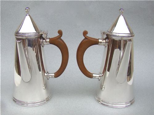 fig 1. PAIR OF SILVER COFFEE POTS, IN THE STYLE OF WILLIAM & MARY, BY THOMAS BRADBURY, SHEFFIELD 1933