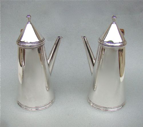 fig 2. PAIR OF SILVER COFFEE POTS, IN THE STYLE OF WILLIAM & MARY, BY THOMAS BRADBURY, SHEFFIELD 1933