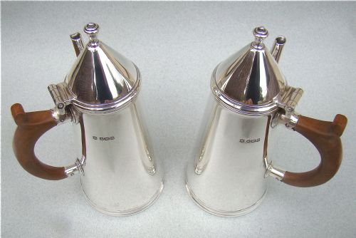 fig 3. PAIR OF SILVER COFFEE POTS, IN THE STYLE OF WILLIAM & MARY, BY THOMAS BRADBURY, SHEFFIELD 1933