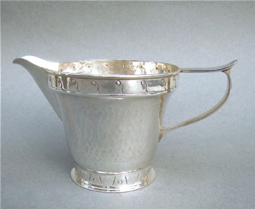 fig 1. ARTS & CRAFT SILVER CREAM JUG BY A.E. JONES, BIRMINGHAM 1924