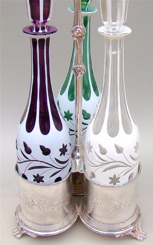 fig 2. SET OF THREE 19TH C. BOHEMIAN GLASS DECANTERS WITH SILVER PLATED STAND, CIRCA 1890