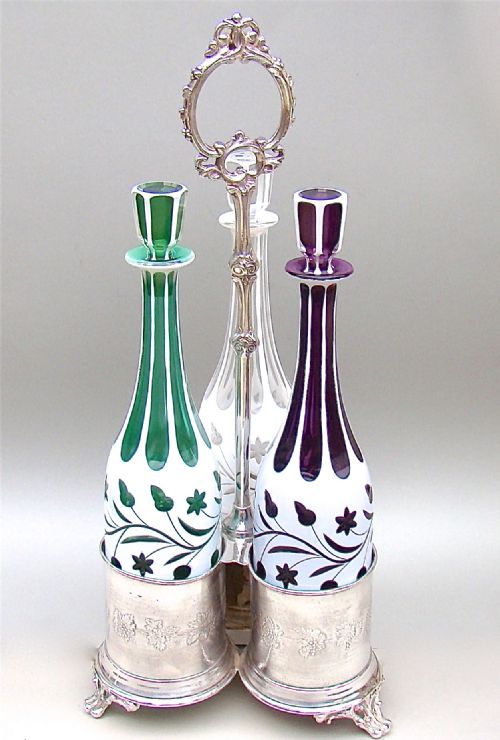 fig 1. SET OF THREE 19TH C. BOHEMIAN GLASS DECANTERS WITH SILVER PLATED STAND, CIRCA 1890