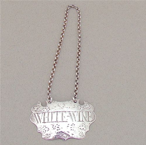 fig 1. GEORGE II ESCUTCHEON WHITE WINE LABEL BY JOHN HARVEY, LONDON CIRCA 1740