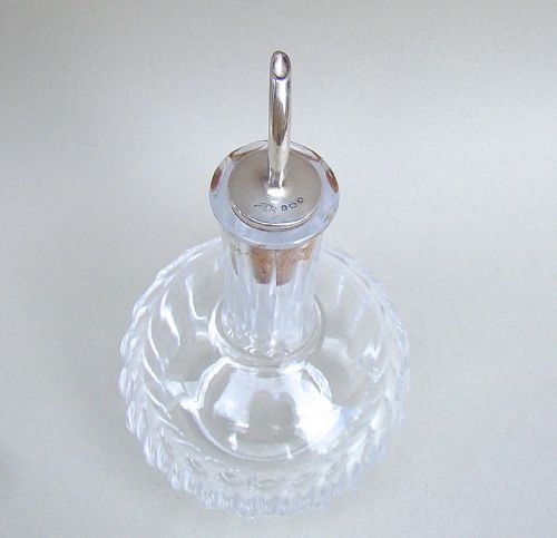 fig 3. GEORGE V SILVER MOUNTED ANGOSTURA BITTERS BOTTLE BY JOHN GRINSELL & SONS, BIRMINGHAM 1922