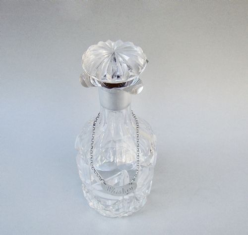 fig 1. SMALL ART DECO SILVER MOUNTED GLASS DECANTER, BIRMINGHAM 1928 WITH EDWARDIAN SILVER WHISKY LABEL, LONDON 1904
