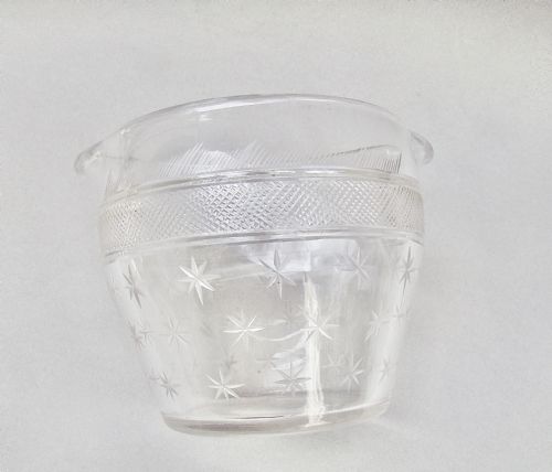 fig 2. A clear late 18th-century Georgian glass rinser featuring twin pouring spouts, a diamond-cut waistband, and starburst motifs etched around the lower bowl.