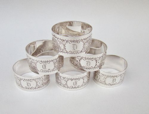 fig 1. SET OF SIX VICTORIAN SILVER PLATED MONOGRAMMED NAPKIN RINGS, CIRCA 1890