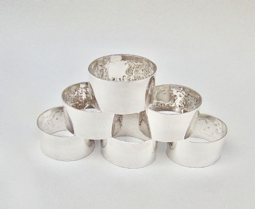 fig 2. SET OF SIX VICTORIAN SILVER PLATED MONOGRAMMED NAPKIN RINGS, CIRCA 1890