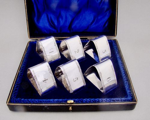 fig 1. SET OF SIX EDWARDIAN SILVER PLATED NUMBERED NAPKIN RINGS, CIRCA 1900