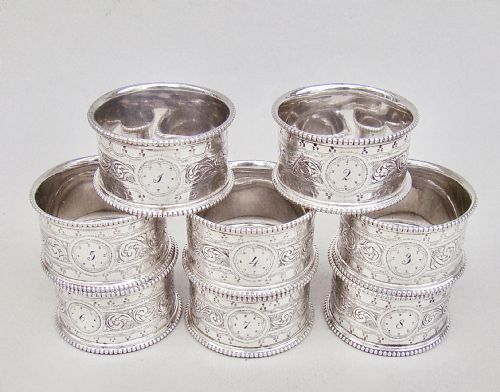 fig 1. CASED SET OF EIGHT VICTORIAN SILVER PLATED NUMBERED NAPKIN RINGS, CIRCA 1880