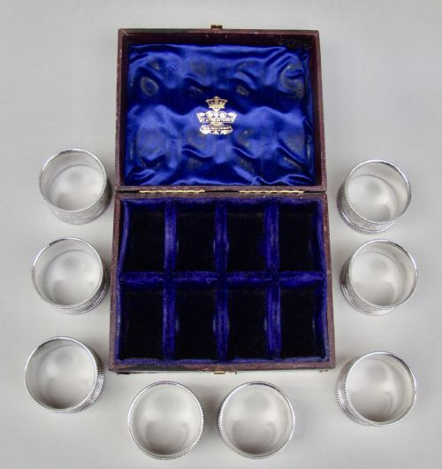 fig 3. CASED SET OF EIGHT VICTORIAN SILVER PLATED NUMBERED NAPKIN RINGS, CIRCA 1880