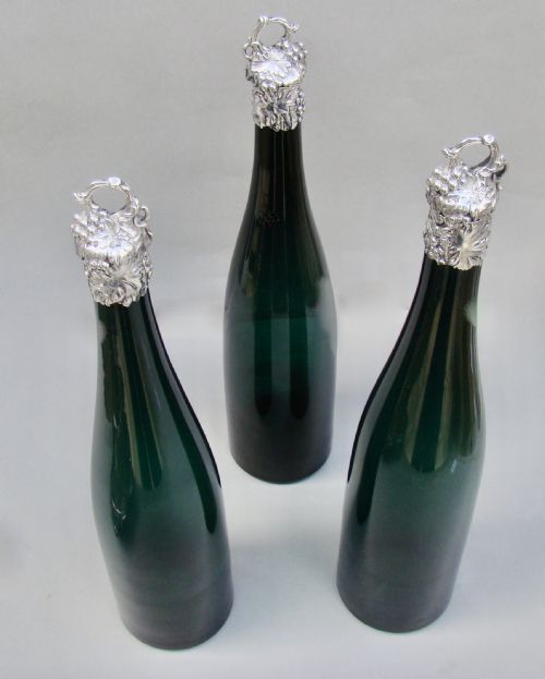 fig 3. SET OF THREE VICTORIAN BRISTOL GREEN GLASS DECANTER BY HENRY WILKINSON & CO, BIRMINGHAM 1839 IN THEIR ORIGINAL SILVER PLATED STAND