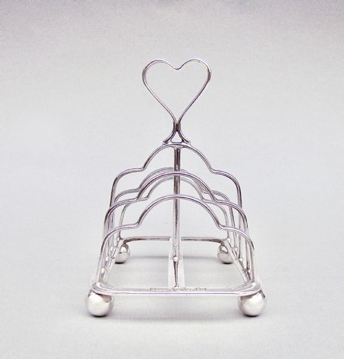 fig 1. VICTORIAN NOVELTY SILVER HEART-SHAPED HANDLED TOAST RACK BY THE ATKINS BROTHERS, SHEFFIELD 1895