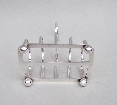 fig 2. VICTORIAN NOVELTY SILVER HEART-SHAPED HANDLED TOAST RACK BY THE ATKINS BROTHERS, SHEFFIELD 1895