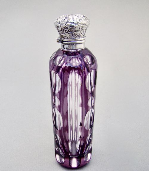 fig 1. EXQUISITE SILVER MOUNTED AMETHYST OVERLAY GLASS SCENT BOTTLE, CIRCA 1890