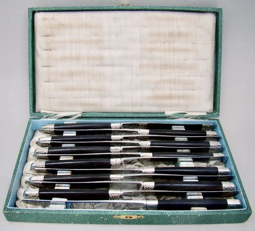 fig 1. FABULOUS CASED SET OF TWELVE SILVER PLATED FRENCH TABLE KNIVES WITH EBONY HANDLES AND STEEL BLADES, PARIS CIRCA 1890