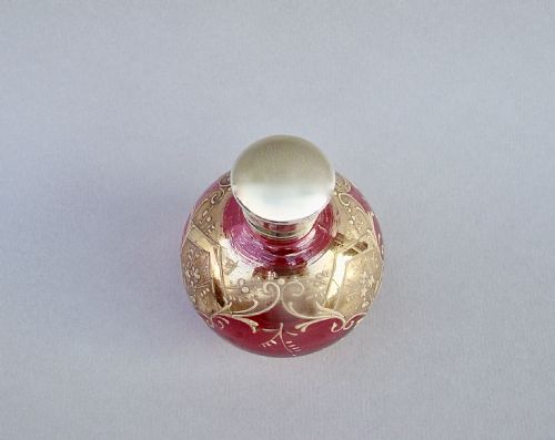 fig 2. VICTORIAN SILVER GILT ENAMELLED CRANBERRY GLASS SCENT BOTTLE, CIRCA 1890