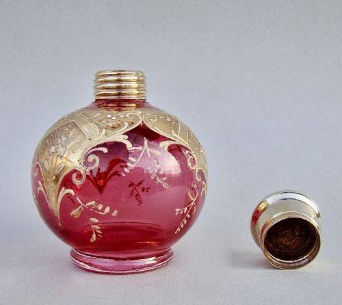 fig 3. VICTORIAN SILVER GILT ENAMELLED CRANBERRY GLASS SCENT BOTTLE, CIRCA 1890