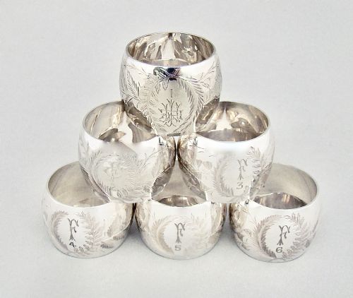 fig 3. EXQUISITE CASED SET OF SIX VICTORIAN SILVER PLATED NUMBERED AND INITIALLED NAPKIN RINGS, CIRCA 1890