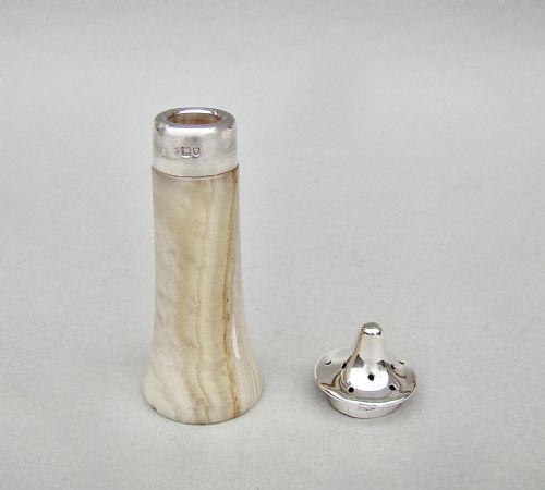 fig 2. An Edwardian silver-mounted agate pepper pot featuring a carved stone base with a hallmark-stamped sterling silver collar and perforated cap.