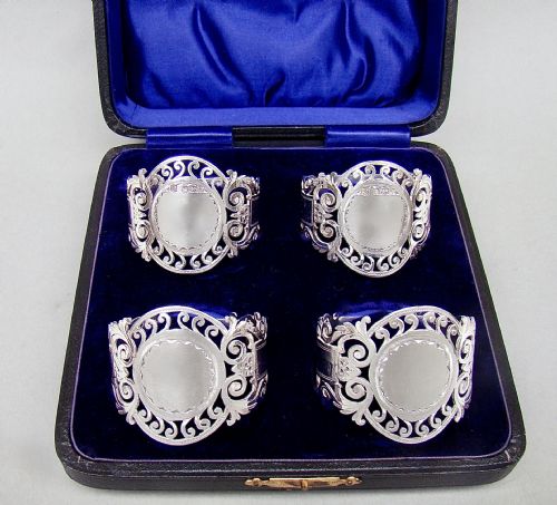 fig 1. CASED SET OF FOUR EDWARDIAN SOLID SILVER NAPKIN RINGS BY COOPER BROTHERS, SHEFFIELD 1907