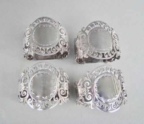 fig 2. CASED SET OF FOUR EDWARDIAN SOLID SILVER NAPKIN RINGS BY COOPER BROTHERS, SHEFFIELD 1907