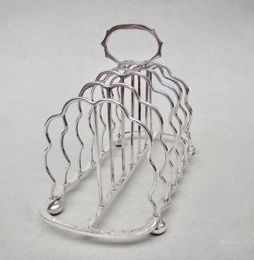 Good Edwardian Solid Silver Toast Rack by S. Garrard, London 1905