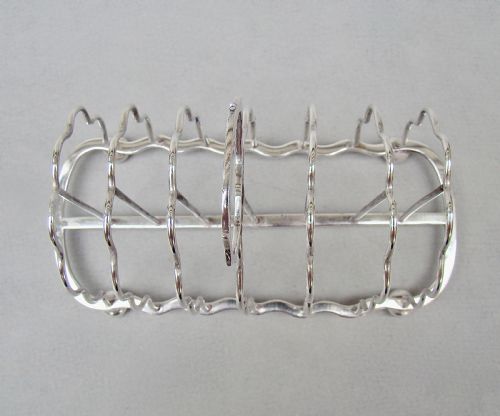 fig 3. GOOD EDWARDIAN SOLID SILVER TOAST RACK BY S. GARRARD, LONDON 1905