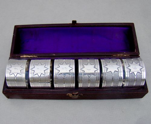fig 1. CASED SET OF SIX VICTORIAN SILVER PLATED NUMBERED NAPKIN RINGS, CIRCA 1890