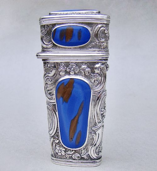 fig 2. An 18th-century French silver travelling etui featuring ornate repousse scrollwork and inlaid blue aventurine panels.