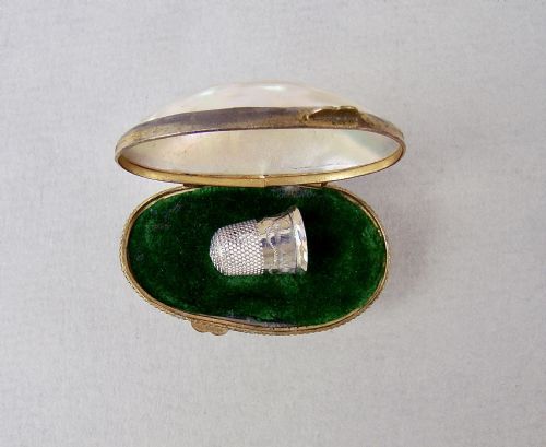 fig 1. RARE 19TH C. MINIATURE SILVER THIMBLE FOR A CHILD IN MOTHER OF PEARL EGG-SHAPED CASE.