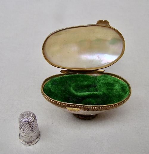 fig 2. RARE 19TH C. MINIATURE SILVER THIMBLE FOR A CHILD IN MOTHER OF PEARL EGG-SHAPED CASE.