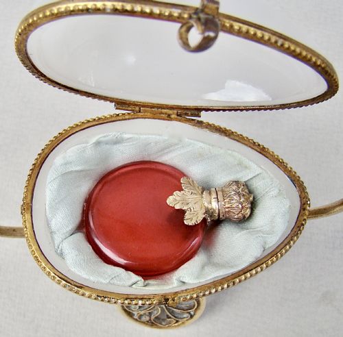 fig 3. RARE 19TH C. FRENCH PALAIS ROYAL CRANBERRY GLASS SCENT BOTTLE IN OPALINE GLASS EGG CASKET, CIRCA 1880
