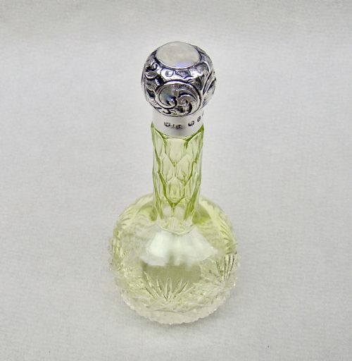 fig 1. VICTORIAN SILVER MOUNTED LIME GREEN CUT GLASS SCENT BOTTLE BY THE MOUSLEY BROTHERS, BIRMINGHAM 1898