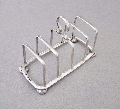 fig 1. ELEGANT EDWARDIAN SILVER TOAST RACK BY JOSEPH GLOSTER, BIRMINGHAM 1908