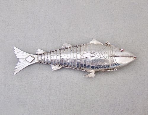 fig 2. A Victorian sterling silver spice box sculpted in the detailed, flexible form of an articulated fish with stone eyes and engraved scales.