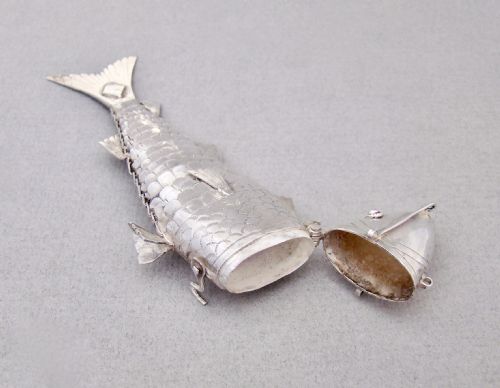 fig 3. A Victorian sterling silver spice box sculpted in the detailed, flexible form of an articulated fish with stone eyes and engraved scales.