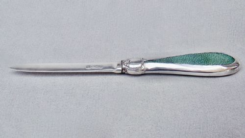fig 1. An Art Deco sterling silver letter opener featuring a green shagreen inlay on the handle and British silver hallmarks on the blade.