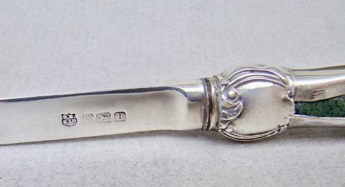 fig 3. An Art Deco sterling silver letter opener featuring a green shagreen inlay on the handle and British silver hallmarks on the blade.