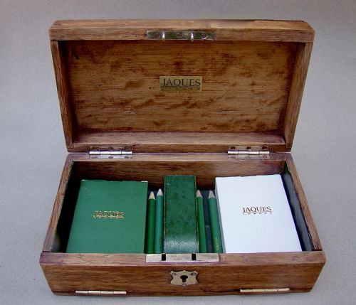 fig 3. An Edwardian oak box featuring sterling silver ribbon corner mounts and a silver script word reading Bridge on the lid.