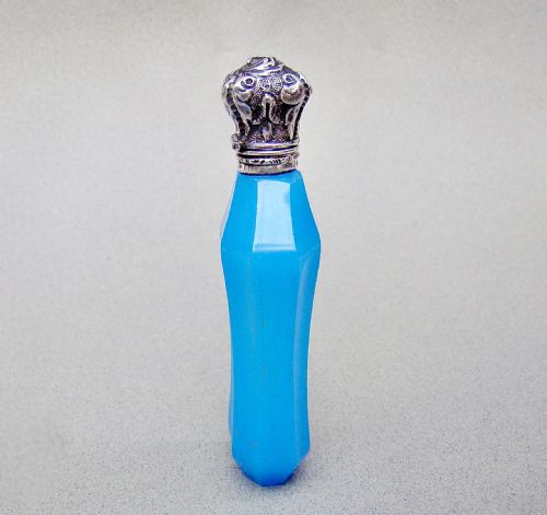 fig 1. A faceted turquoise blue opaline glass scent bottle featuring an embossed silver neck and cap.