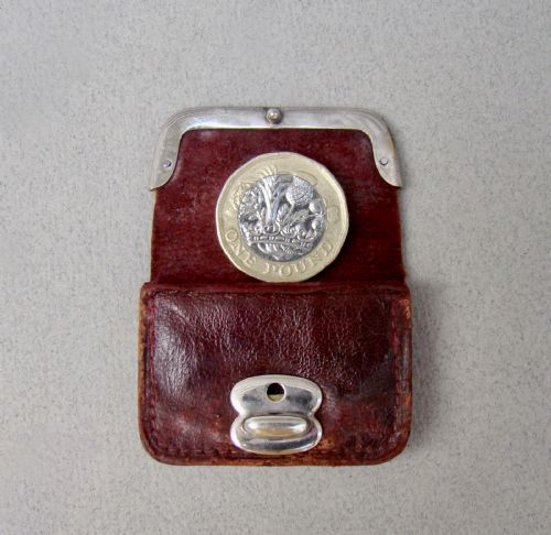 fig 1. A miniature dark brown leather sovereign purse featuring a silver-plated hinged metal catch.