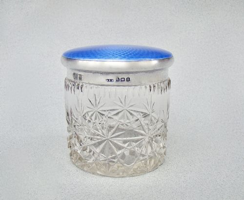 fig 1. Art Deco cut glass dressing table jar featuring a bright blue guilloche enamel lid with sterling silver hallmarks.